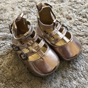 Gold baby shoes